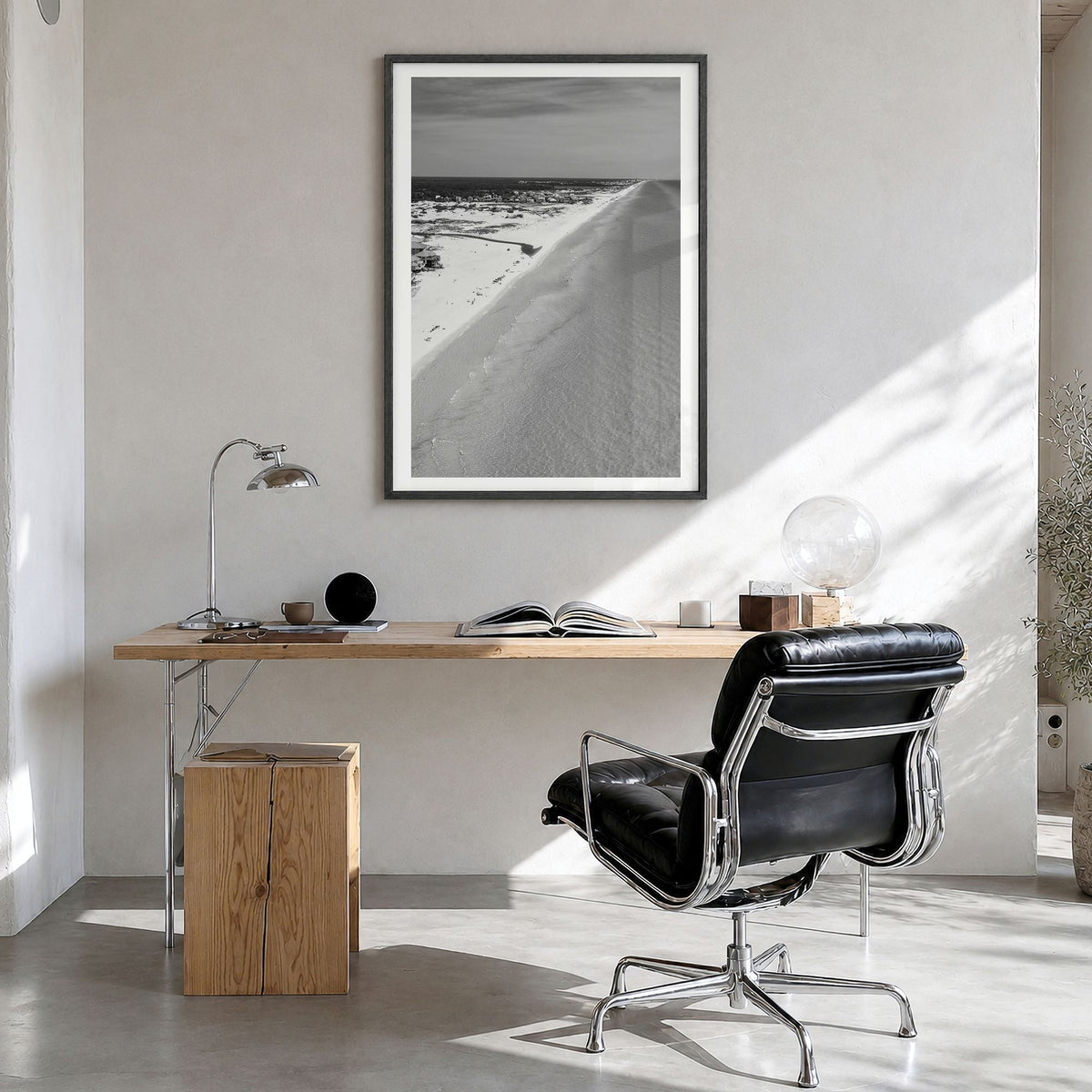 30A Photo Poster in a black wood frame, hanging in a bright home office, white border