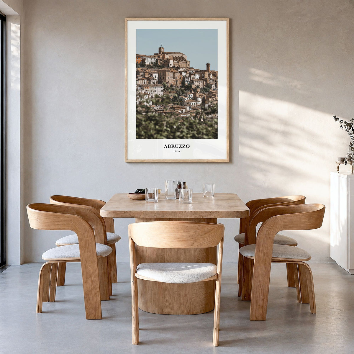 Abruzzo Classic No 1 Poster in a natural wood frame, hanging in a dining room