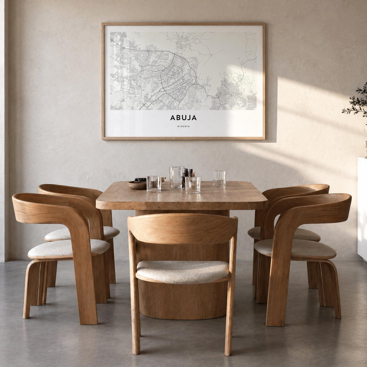 Abuja black & white map poster of Nigeria – horizontal wall art in natural wood frame, hanging on wall