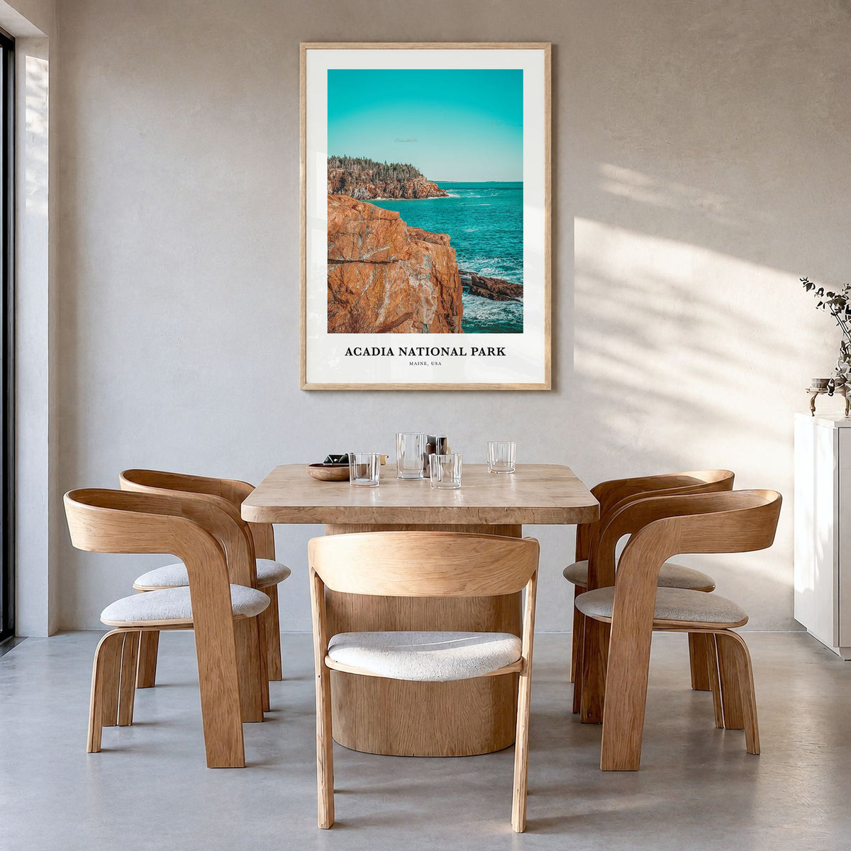 Acadia National Park Classic Poster in a natural wood frame, hanging in a dining room