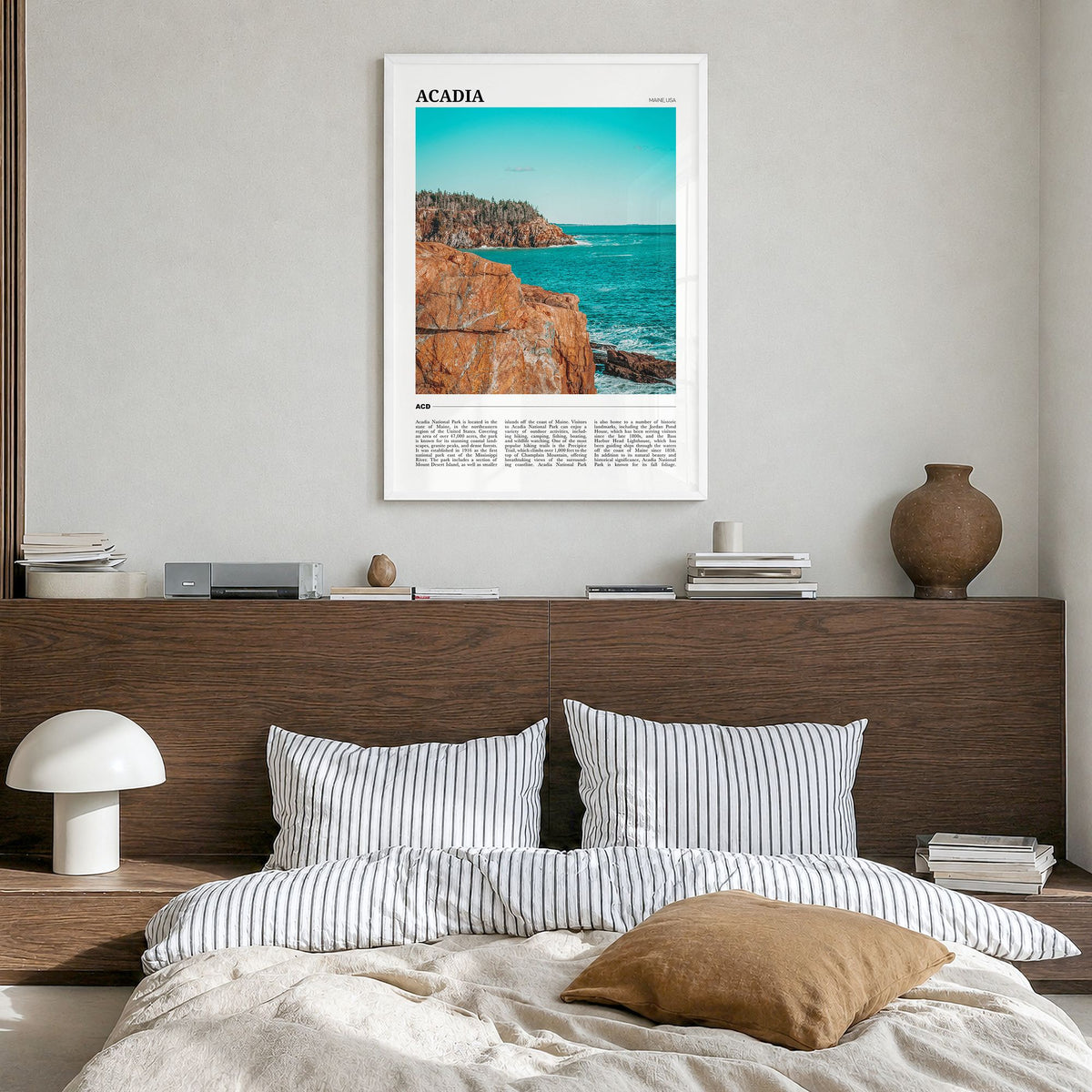 Acadia National Park Travel Poster in a white wood frame, hanging in a bedroom