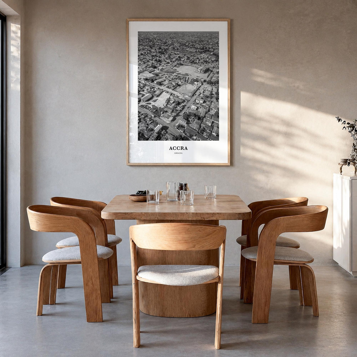 Accra black & white classic poster of Ghana – vertical wall art in natural wood frame, hanging on wall