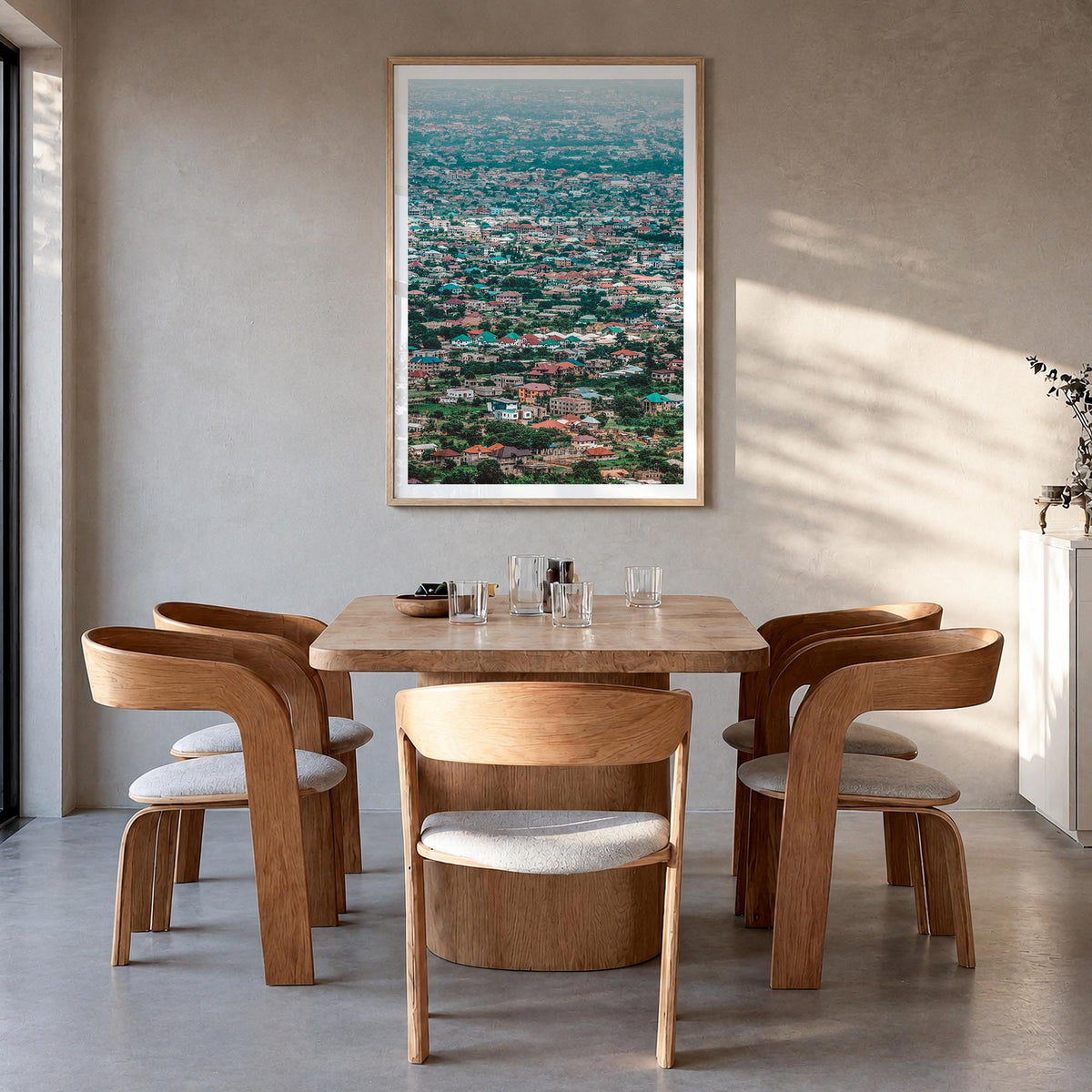Accra colorful photo poster of Ghana – vertical wall art in natural wood frame with white border, hanging on wall