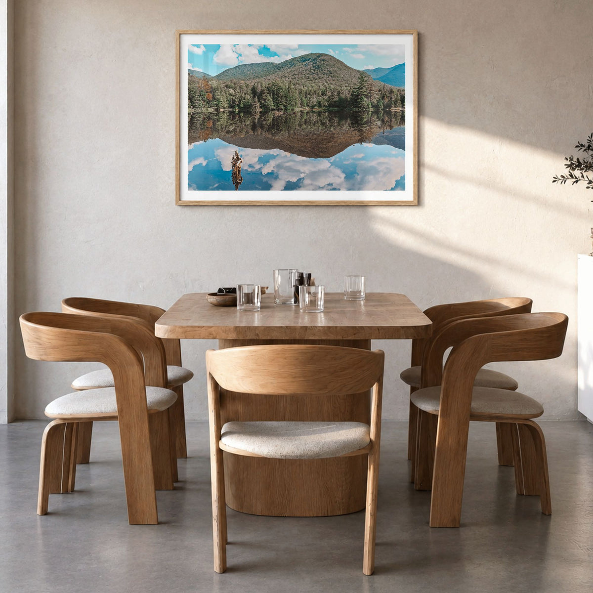 Adirondack Mountains Photo Poster in a natural wood frame, hanging in a dining room, white border