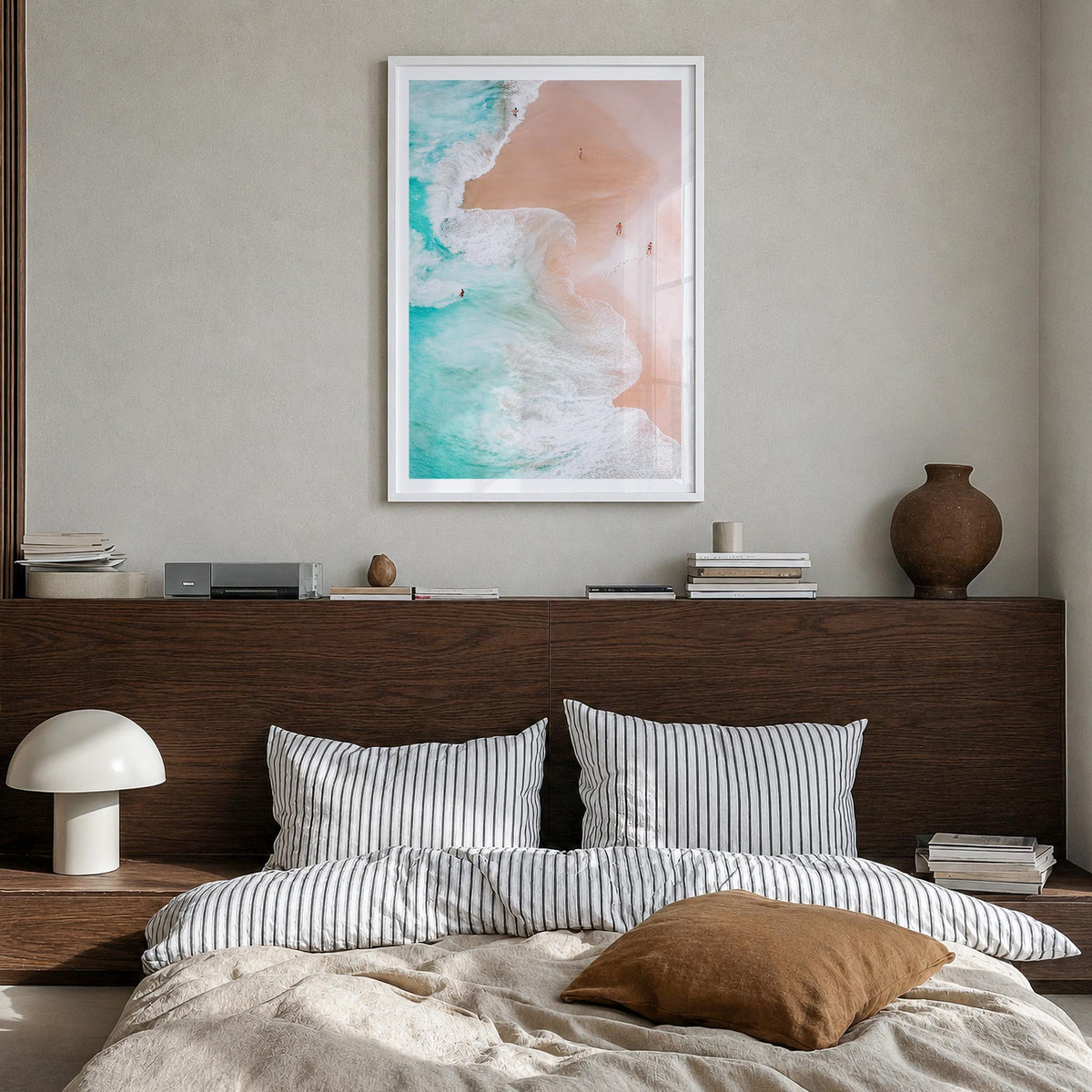 Aerial Beach Waves no. 1 colorful photo poster – vertical wall art in white wood frame with white border, hanging on wall
