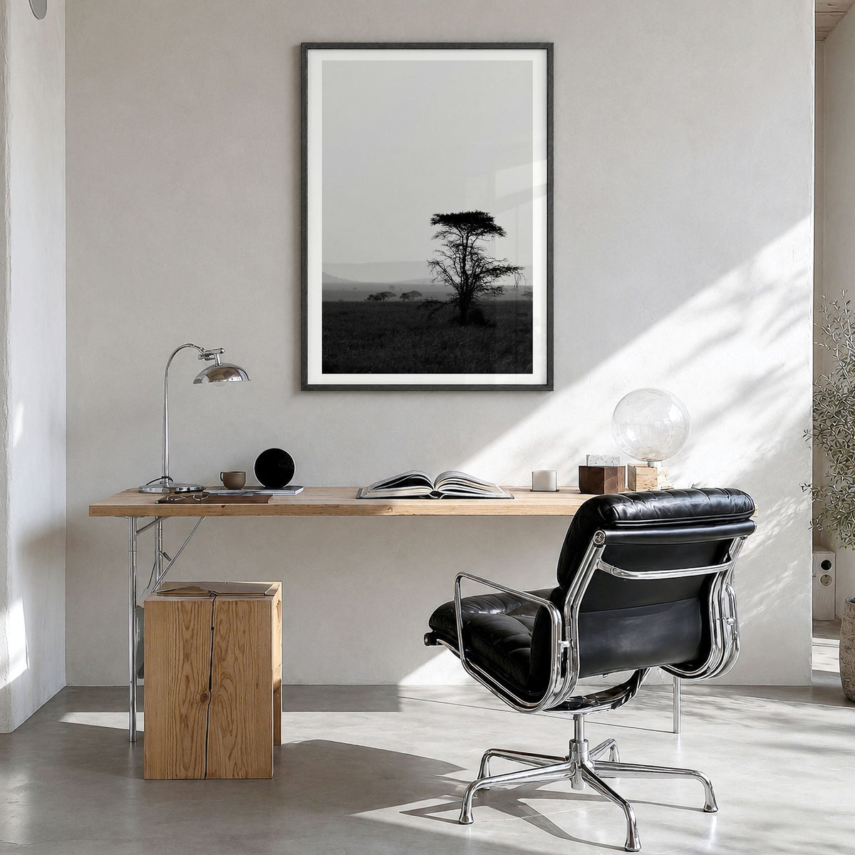 Africa Photo Poster in a black wood frame, hanging in a bright home office, white border