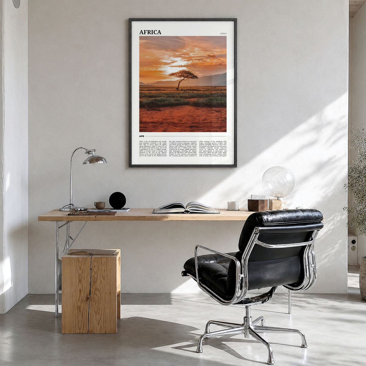 Africa Travel Poster in a black wood frame, hanging in a bright home office