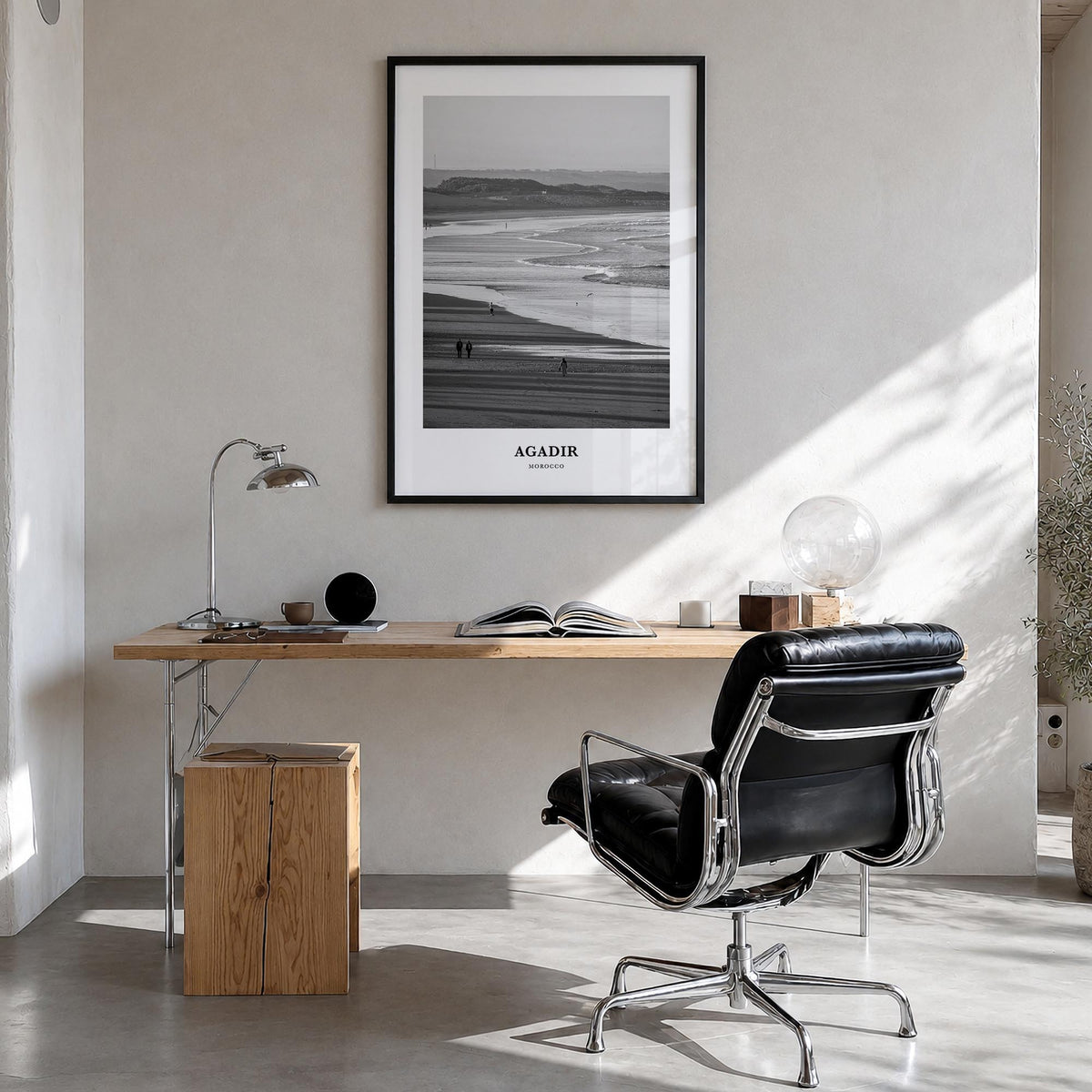 Agadir black & white classic poster of Morocco – vertical wall art in black wood frame, hanging on wall