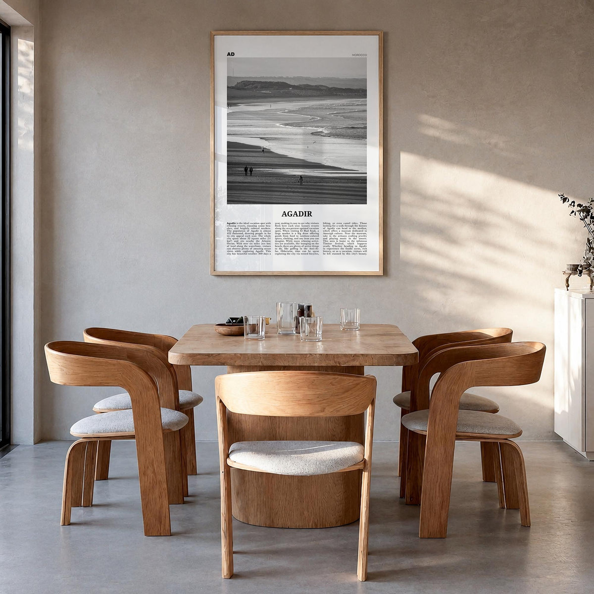 Agadir black & white newspaper poster of Morocco – vertical wall art in natural wood frame, hanging on wall