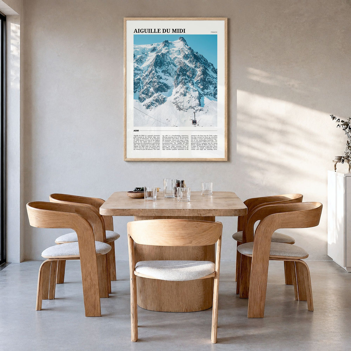 Aiguille du Midi Travel Poster in a natural wood frame, hanging in a dining room