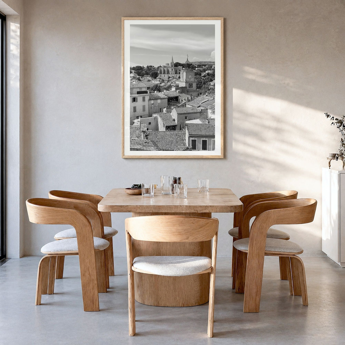 Aix-en-Provence Photo Poster in a natural wood frame, hanging in a dining room, white border