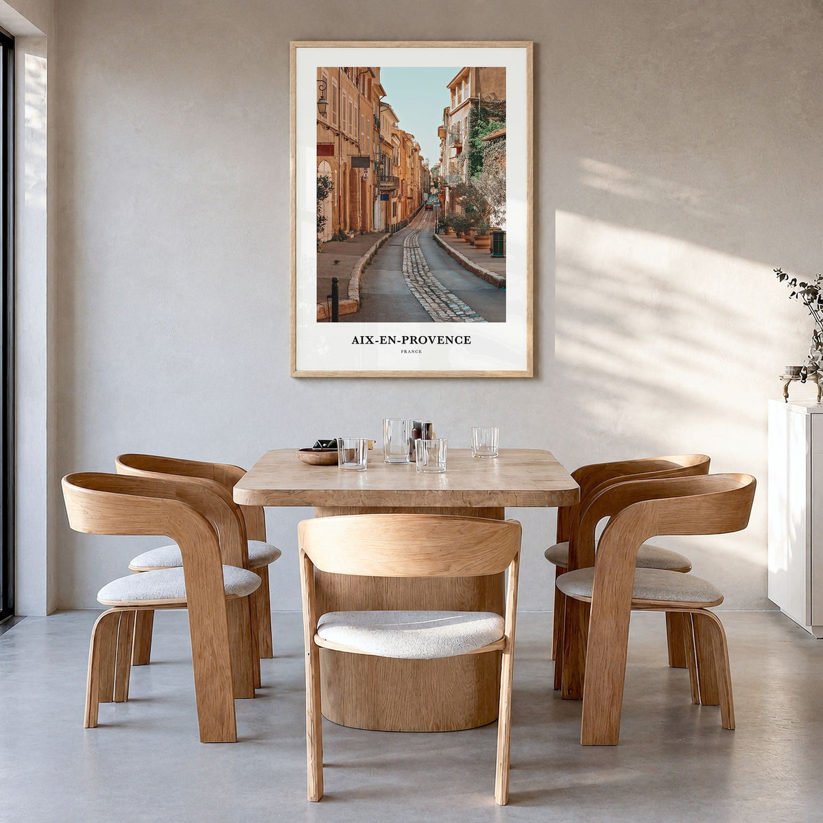 Aix-en-Provence Classic Poster in a natural wood frame, hanging in a dining room