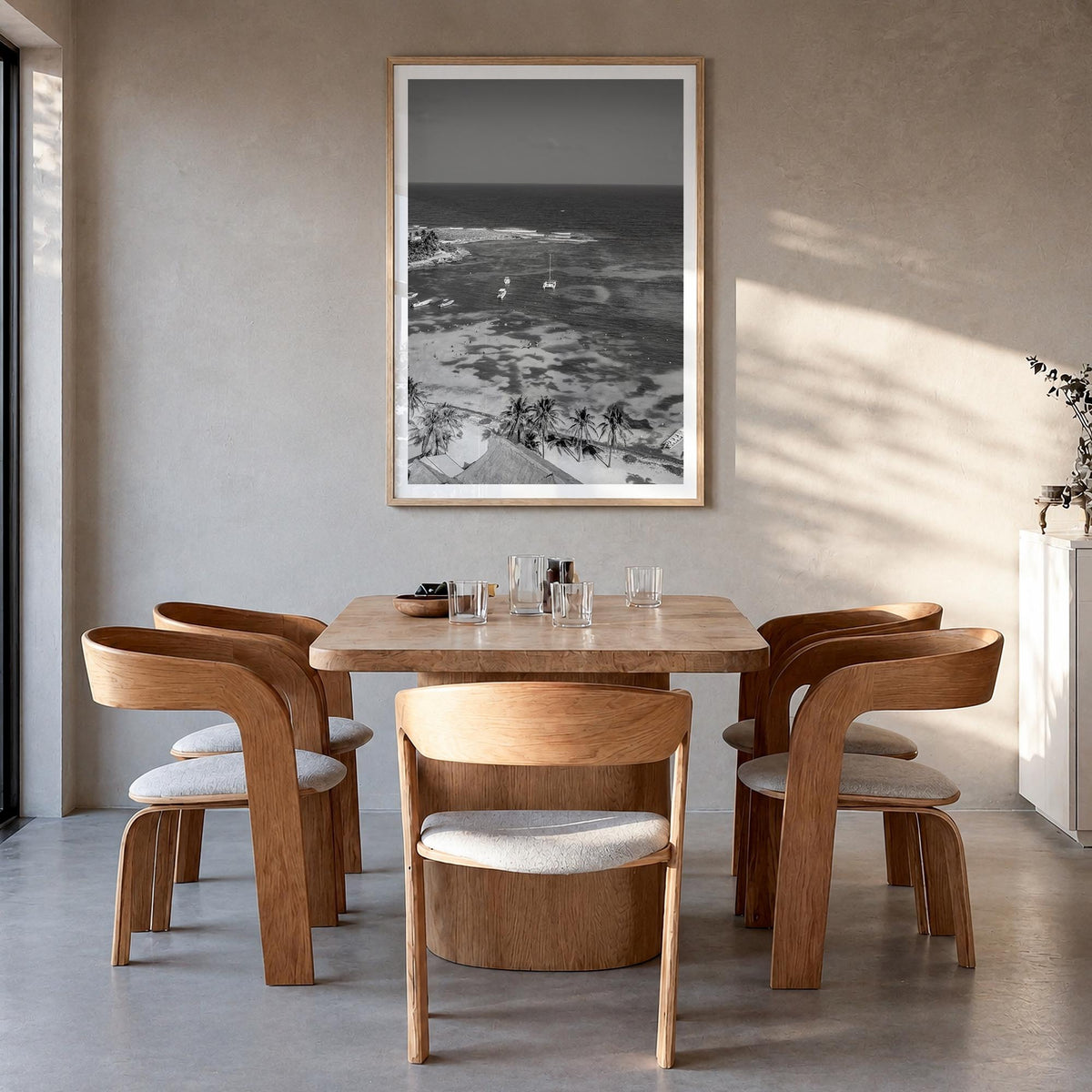 Akumal black & white photo poster of Mexico – vertical wall art in natural wood frame with white border, hanging on wall