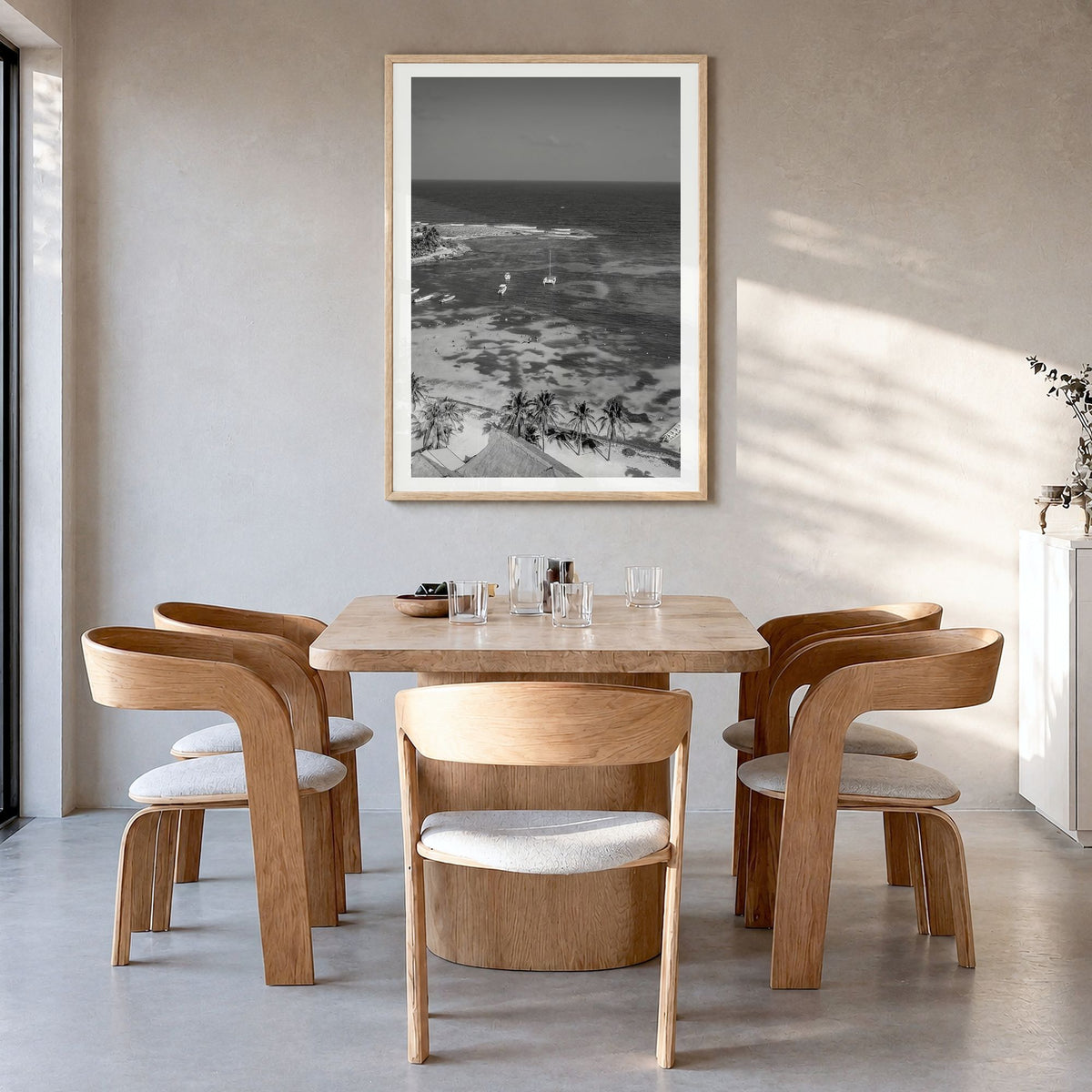Akumal Photo Poster in a natural wood frame, hanging in a dining room, white border