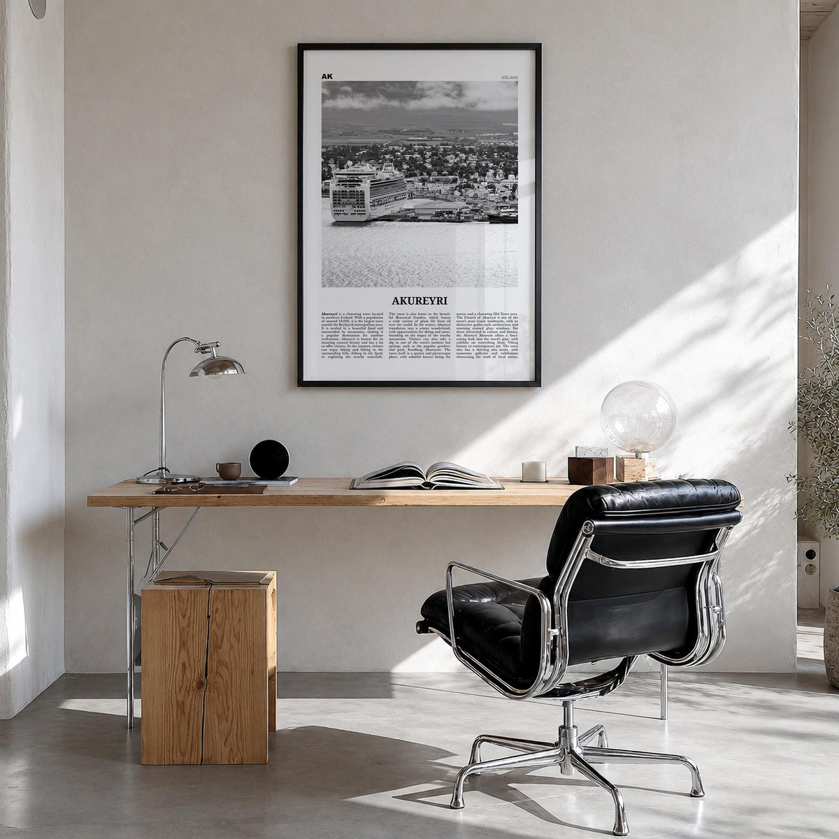 Akureyri black & white newspaper poster of Iceland – vertical wall art in black wood frame, hanging on wall