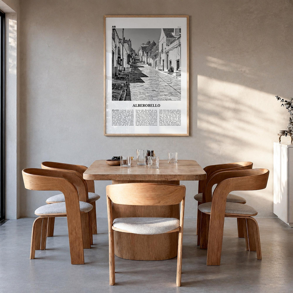 Alberobello black & white newspaper poster of Italy – vertical wall art in natural wood frame, hanging on wall