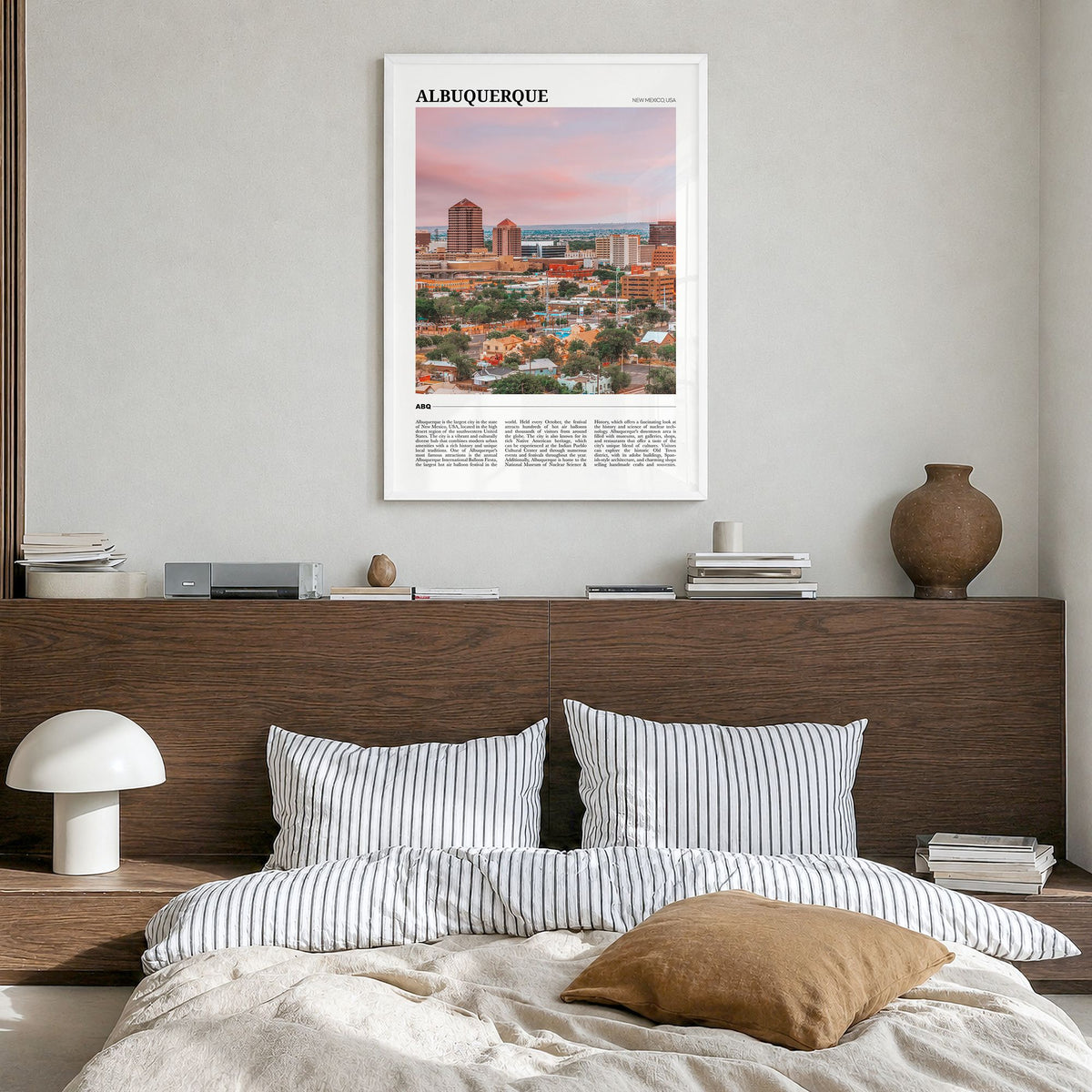 Albuquerque Travel Poster in a white wood frame, hanging in a bedroom