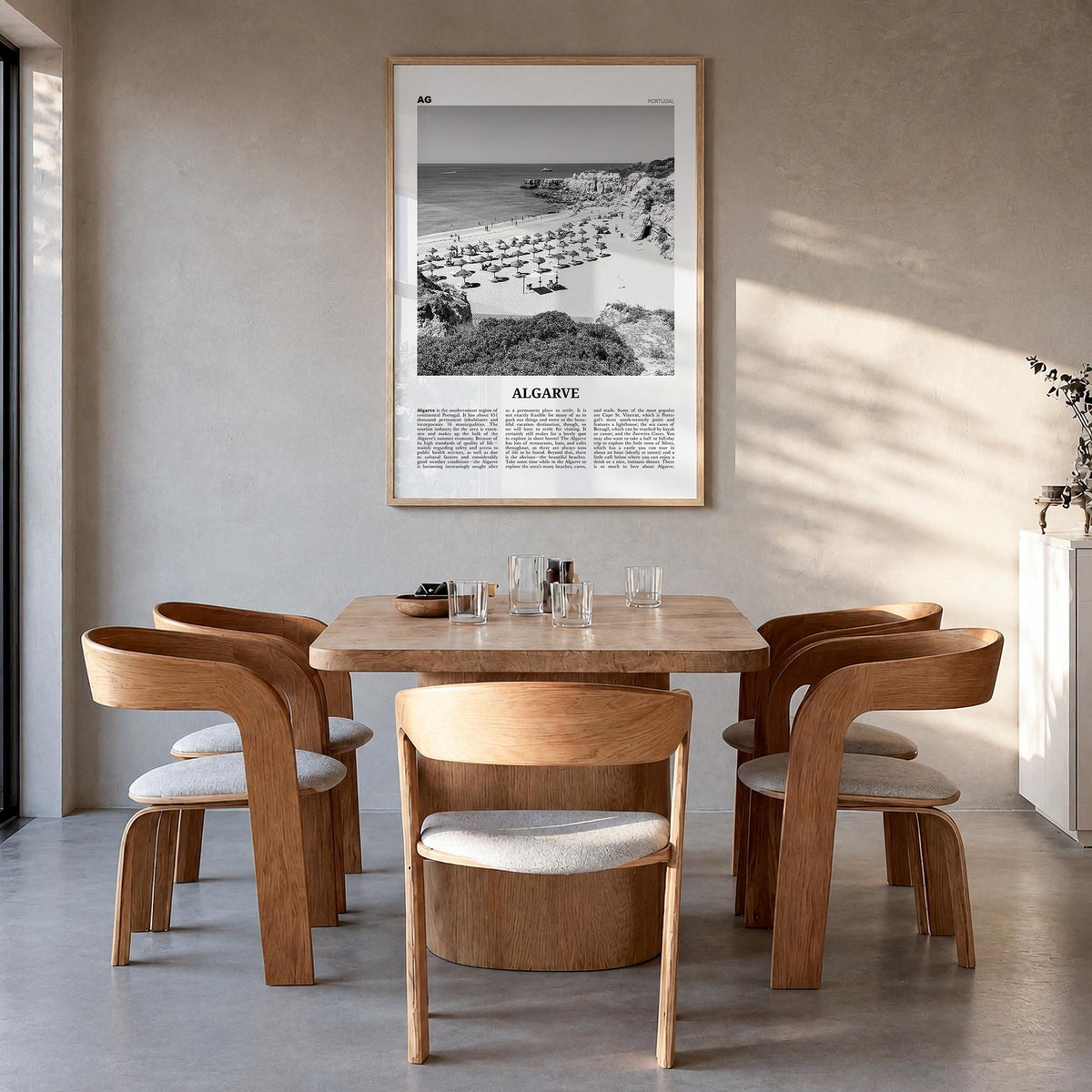 Algarve black & white newspaper poster of Portugal – vertical wall art in natural wood frame, hanging on wall