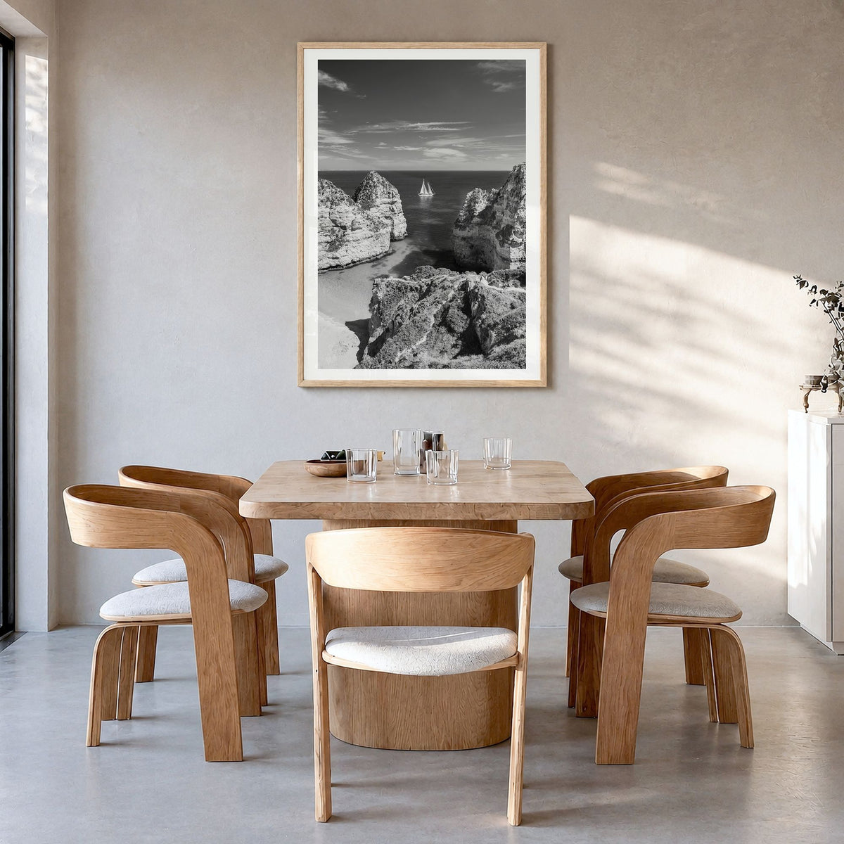 Algarve Photo Poster in a natural wood frame, hanging in a dining room, white border