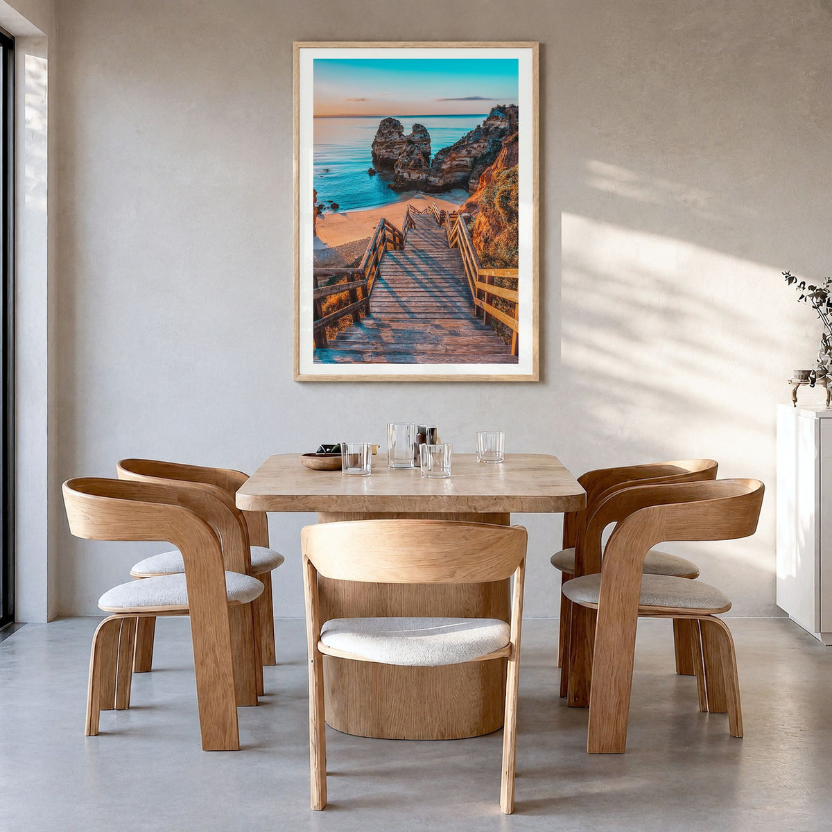 Algarve Photo No 1 Poster in a natural wood frame, hanging in a dining room, white border
