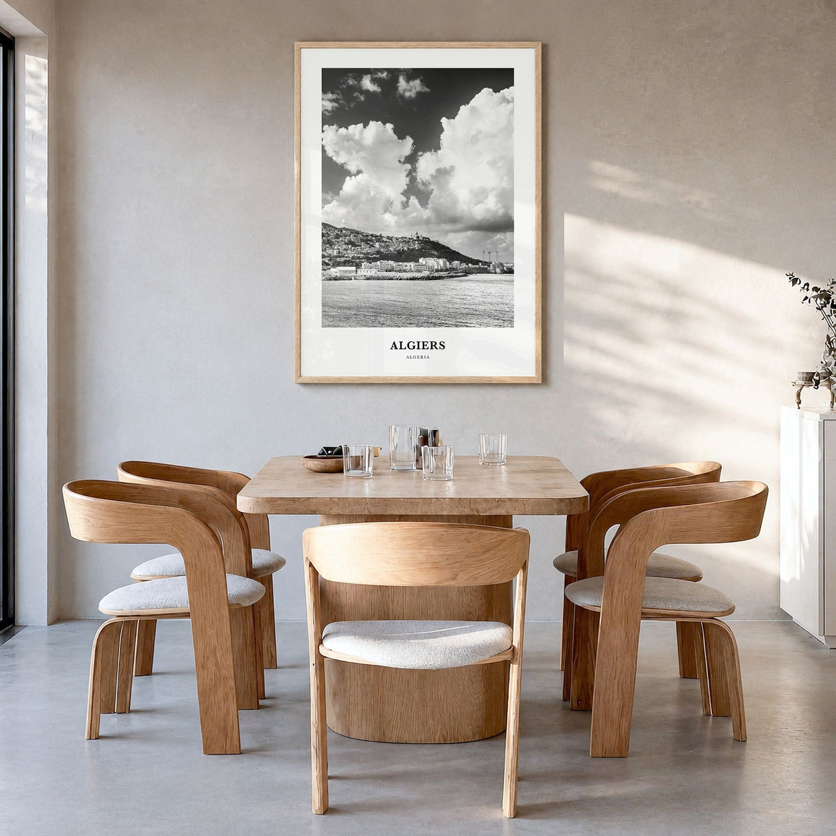 Algiers Classic Poster in a natural wood frame, hanging in a dining room