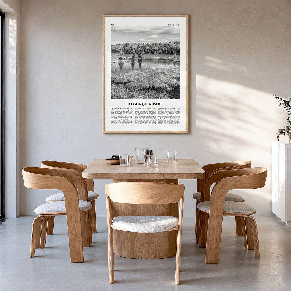 Algonquin Park Newspaper Poster in a natural wood frame, hanging in a dining room