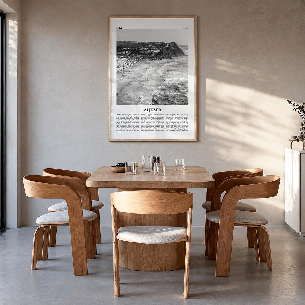 Aljezur black & white newspaper poster of Portugal – vertical wall art in natural wood frame, hanging on wall