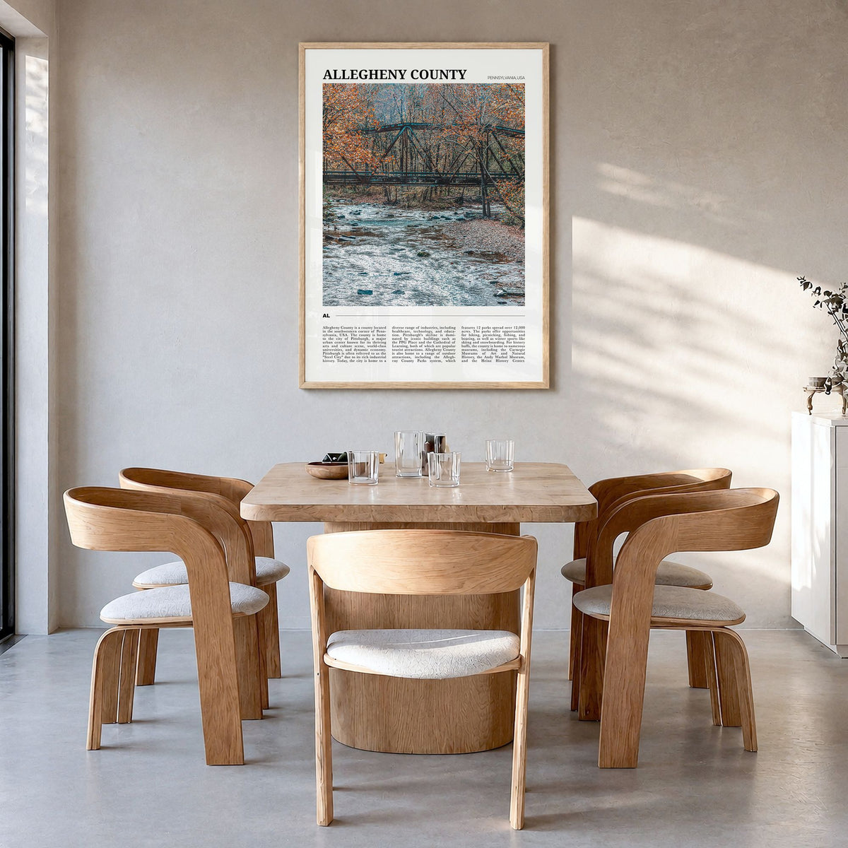 Allegheny County Travel Poster in a natural wood frame, hanging in a dining room