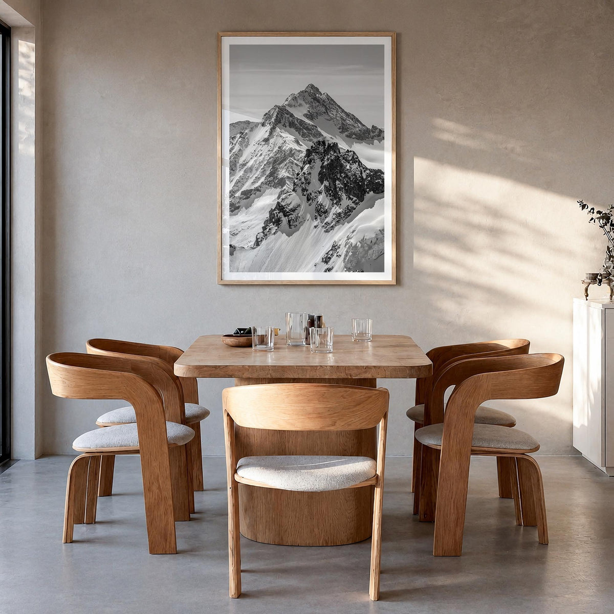 The Alps black & white photo poster of Europe – vertical wall art in natural wood frame with white border, hanging on wall