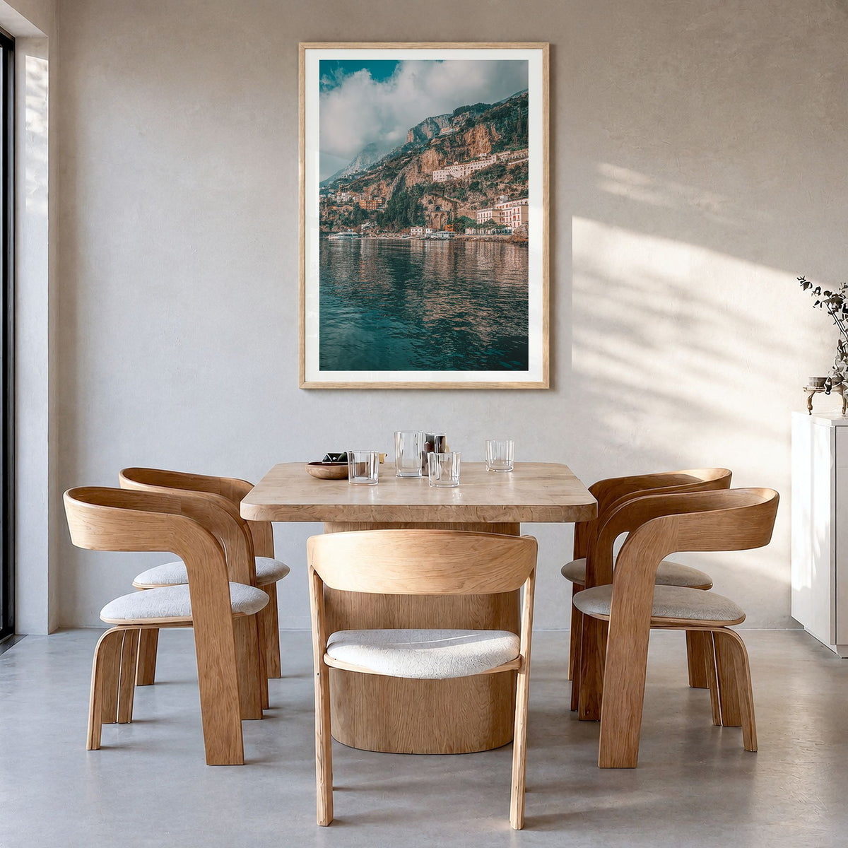 Amalfi Coast Photo No 1 Poster in a natural wood frame, hanging in a dining room, white border