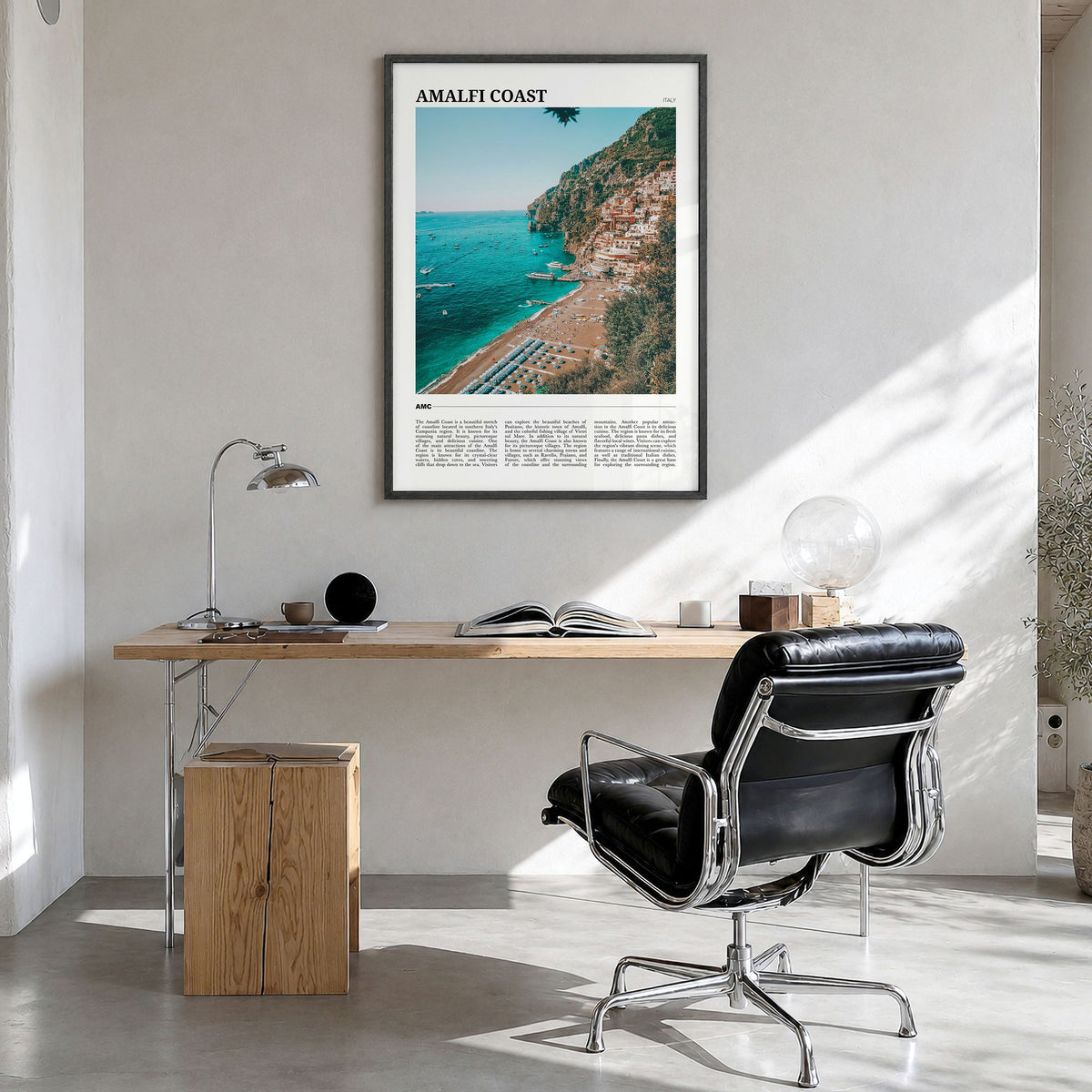 Amalfi Coast Travel Poster in a black wood frame, hanging in a bright home office