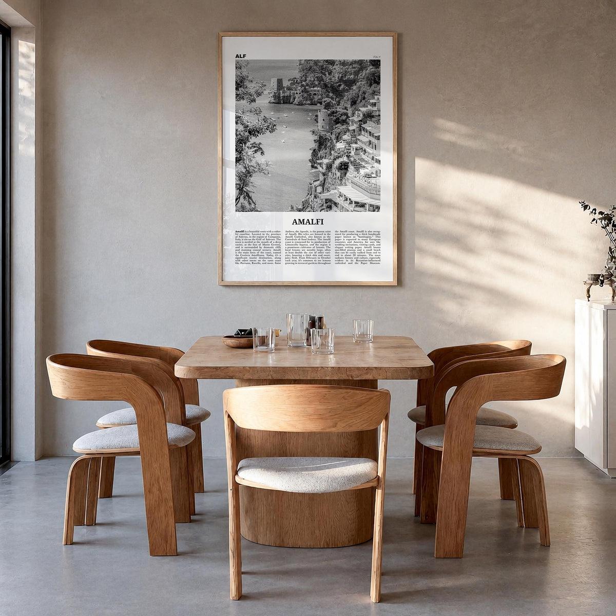 Amalfi no. 2 black & white newspaper poster of Italy – vertical wall art in natural wood frame, hanging on wall