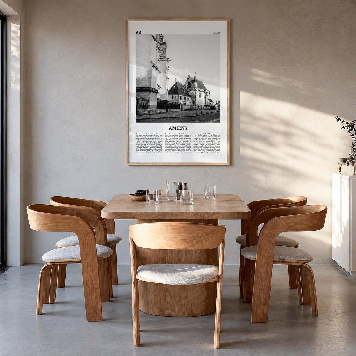 Amiens black & white newspaper poster of France – vertical wall art in natural wood frame, hanging on wall