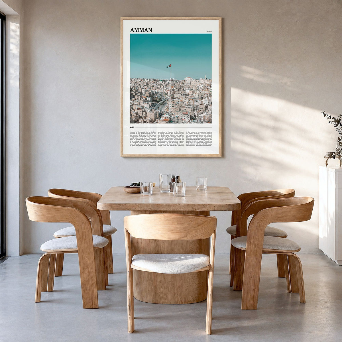 Amman Travel Poster in a natural wood frame, hanging in a dining room