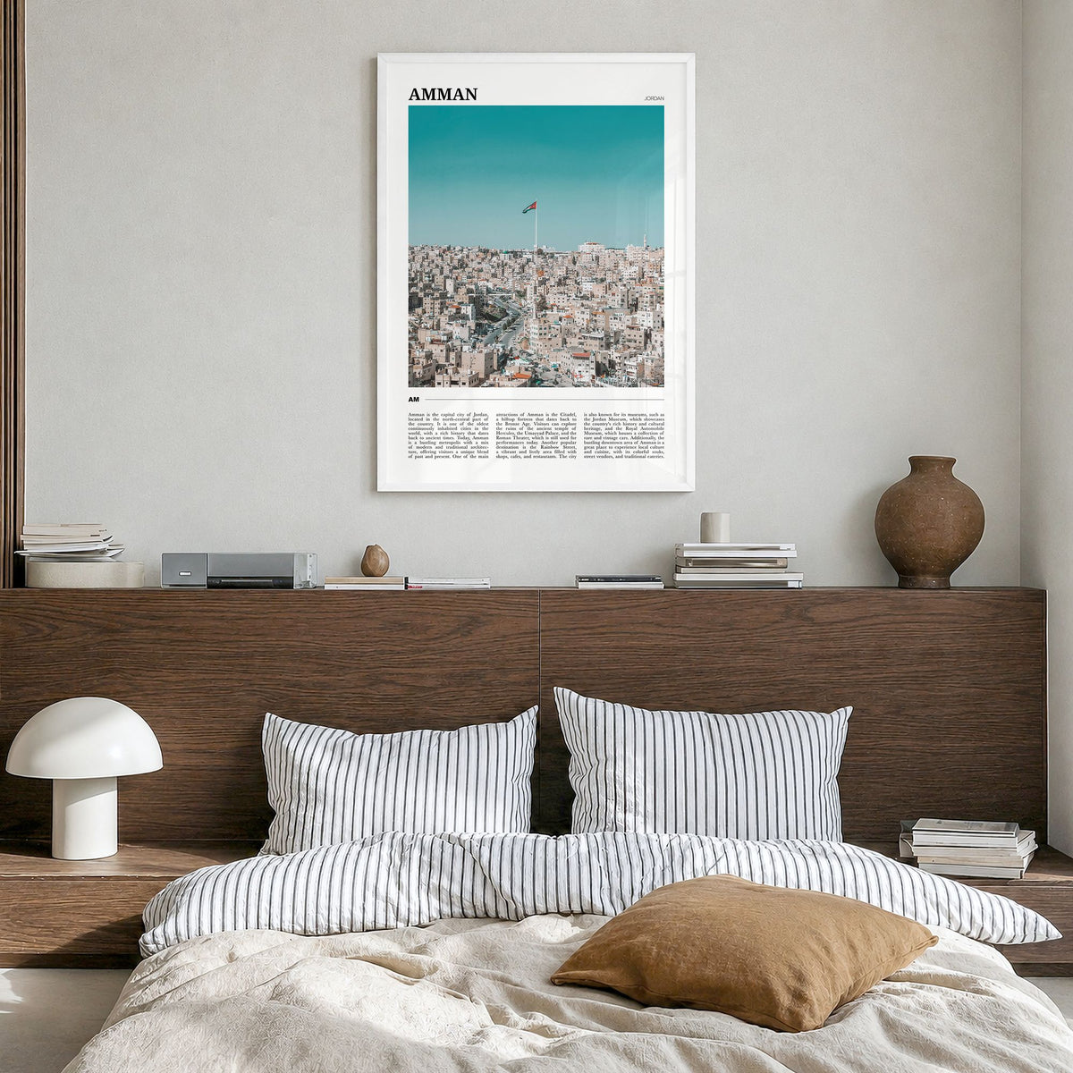 Amman Travel Poster in a white wood frame, hanging in a bedroom