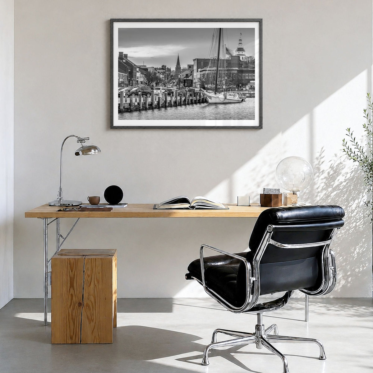 Annapolis Photo Poster in a black wood frame, hanging in a bright home office, white border