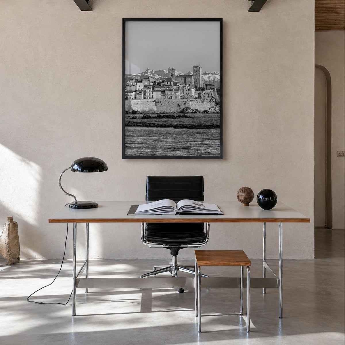 Antibes black & white photo poster of France – vertical wall art in black wood frame, hanging on wall