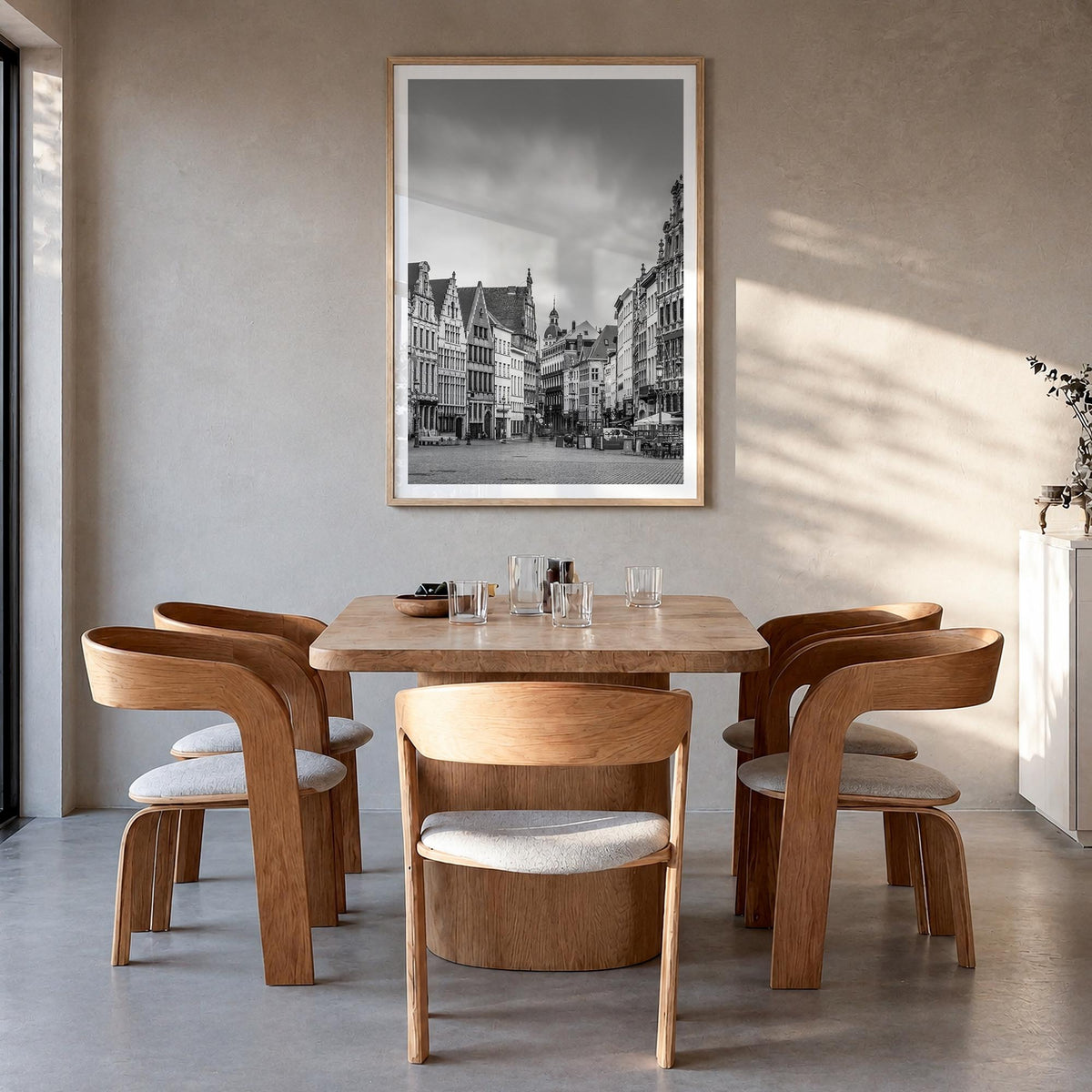 Antwerp black & white photo poster of Belgium – vertical wall art in natural wood frame with white border, hanging on wall