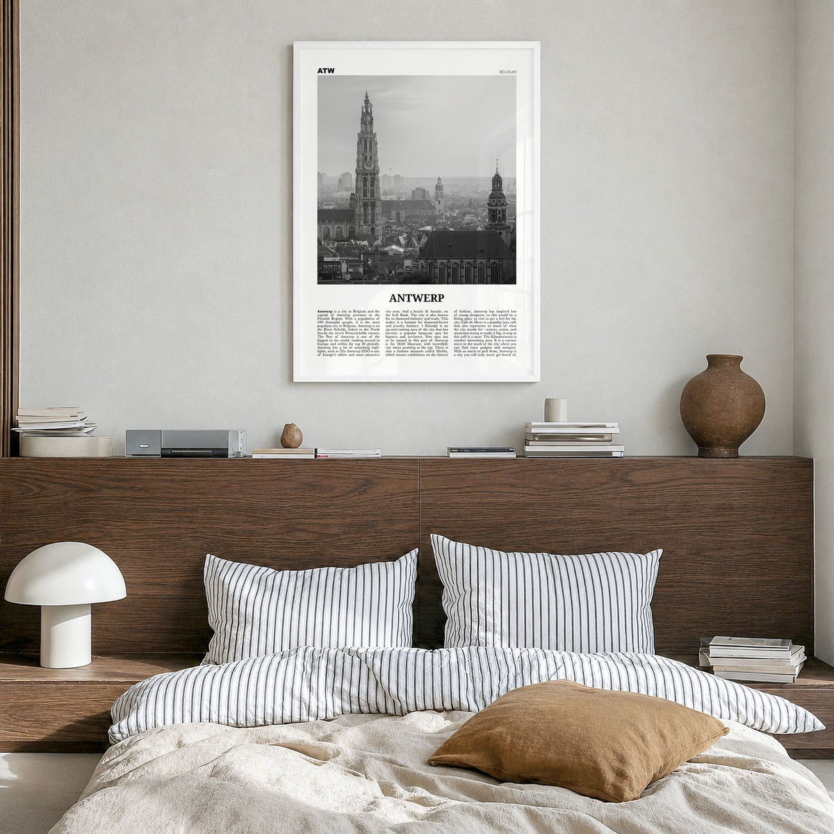 Antwerp Newspaper Poster in a white wood frame, hanging in a bedroom