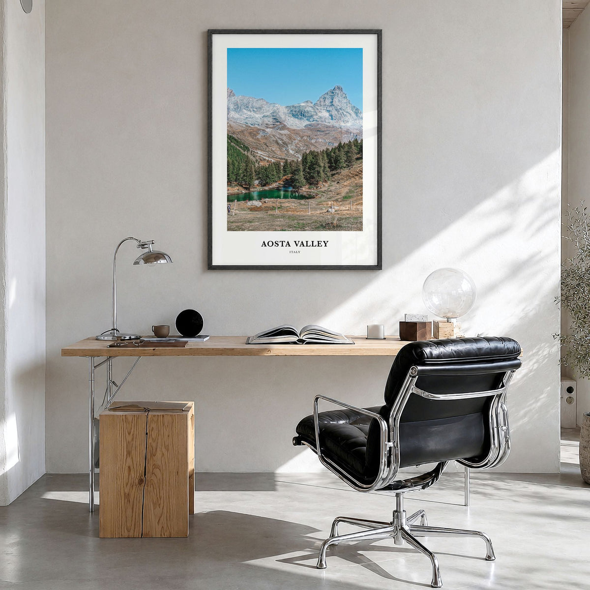 Aosta Valley Classic Poster in a black wood frame, hanging in a bright home office
