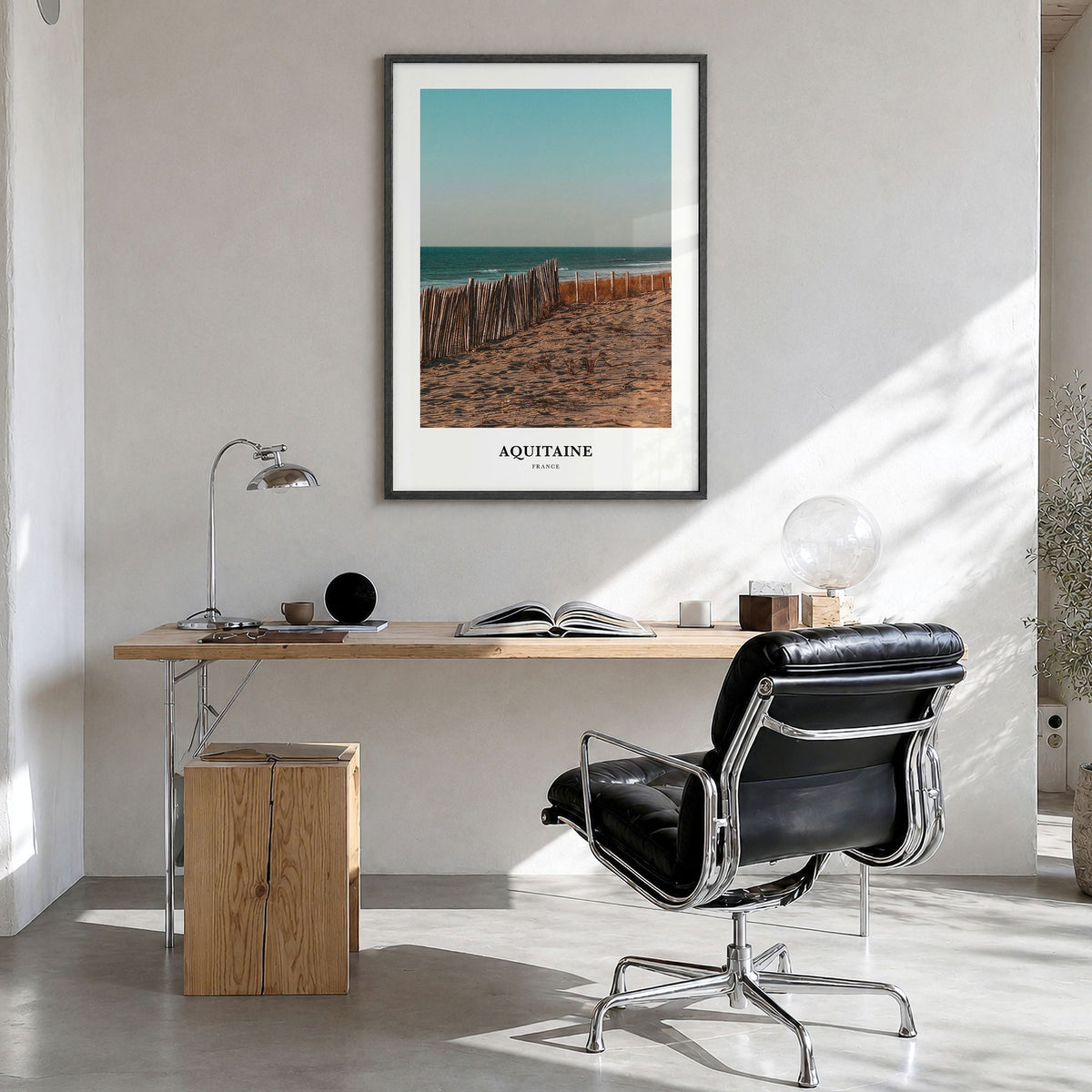 Aquitaine Classic Poster in a black wood frame, hanging in a bright home office