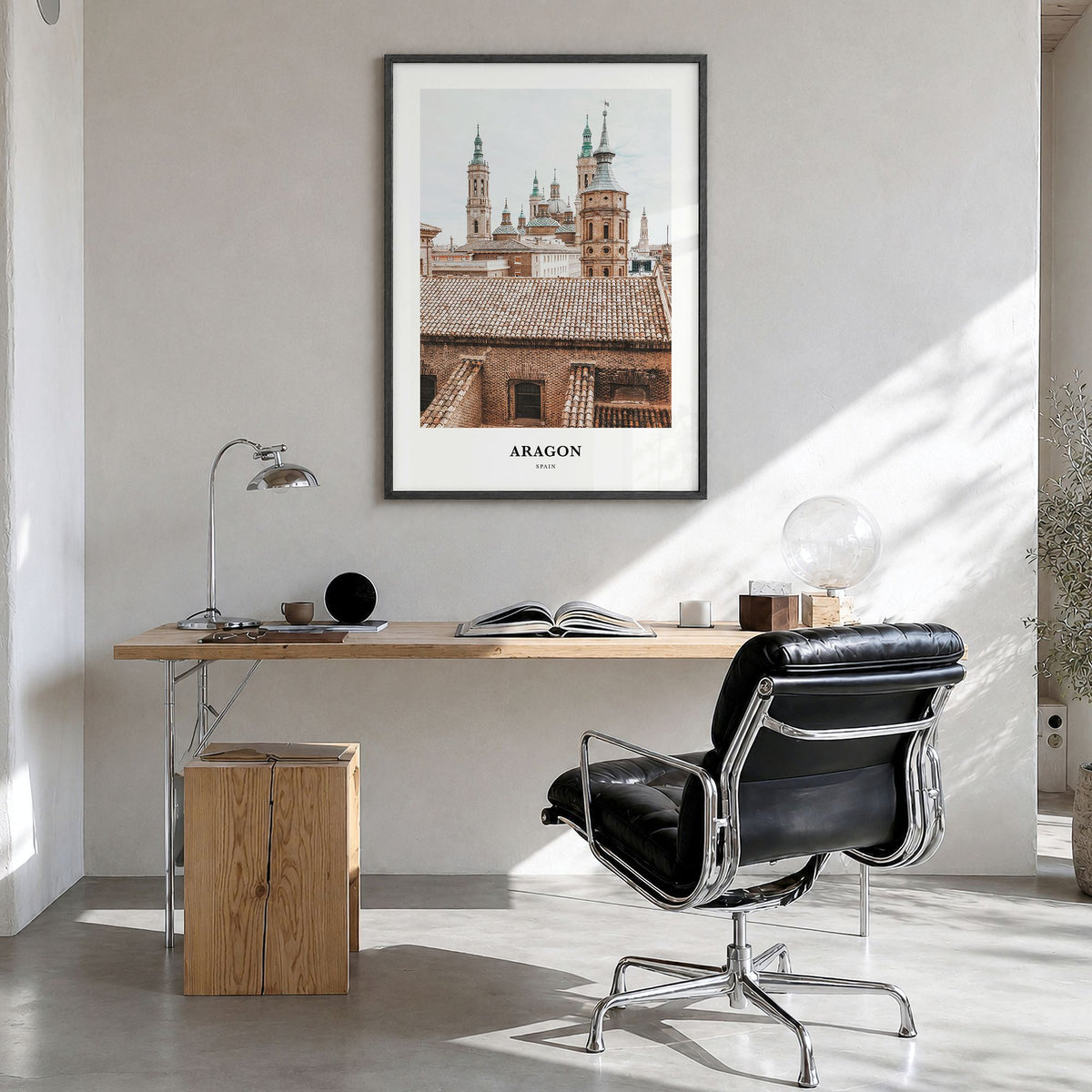 Aragon Classic Poster in a black wood frame, hanging in a bright home office