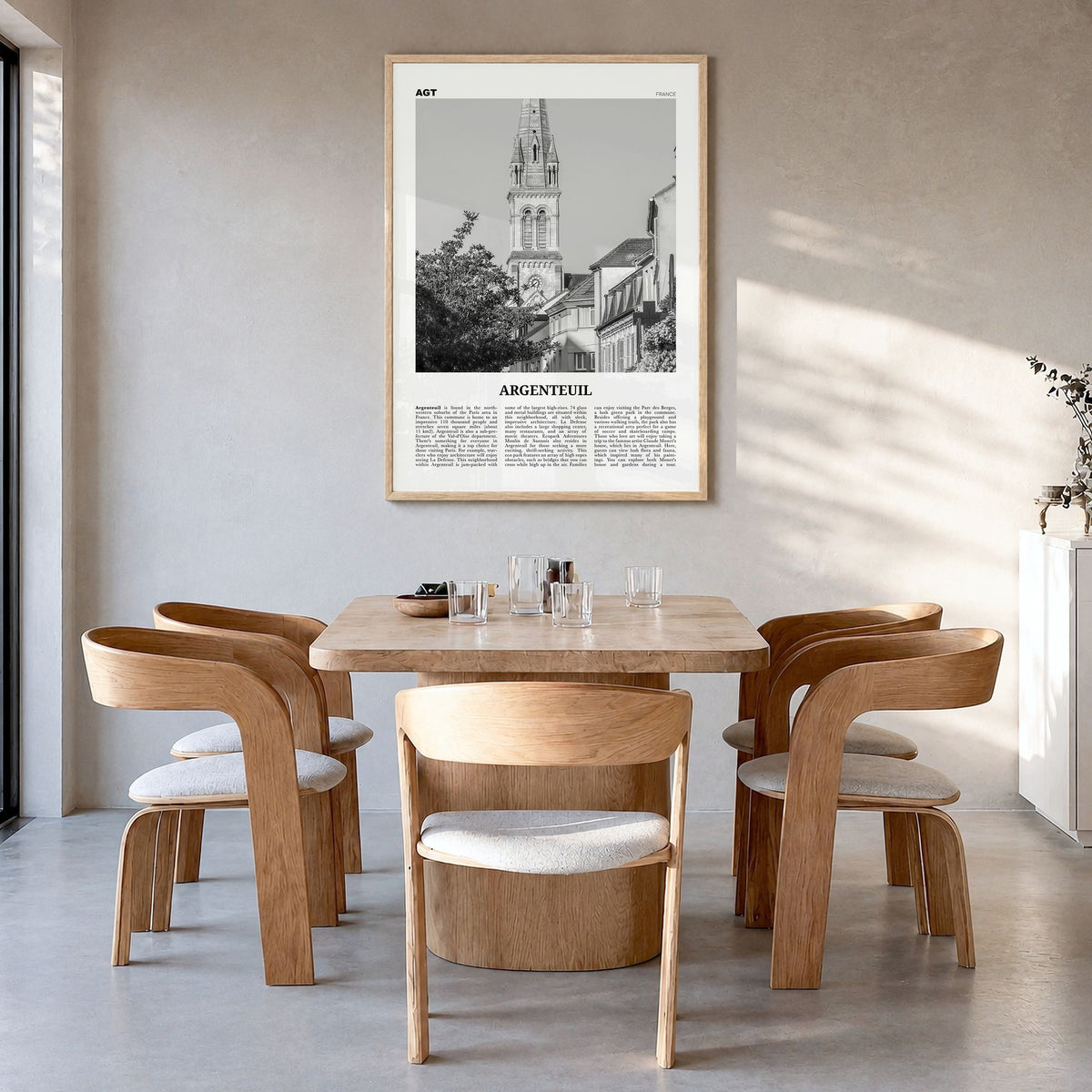 Argenteuil Newspaper Poster in a natural wood frame, hanging in a dining room