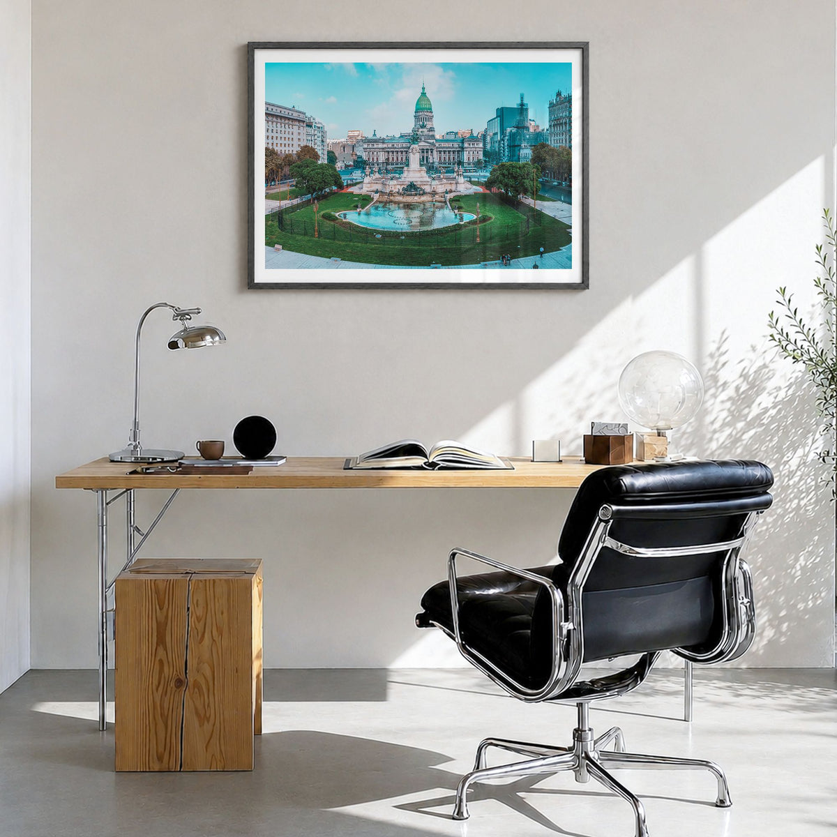 Argentina Photo Poster in a black wood frame, hanging in a bright home office, white border