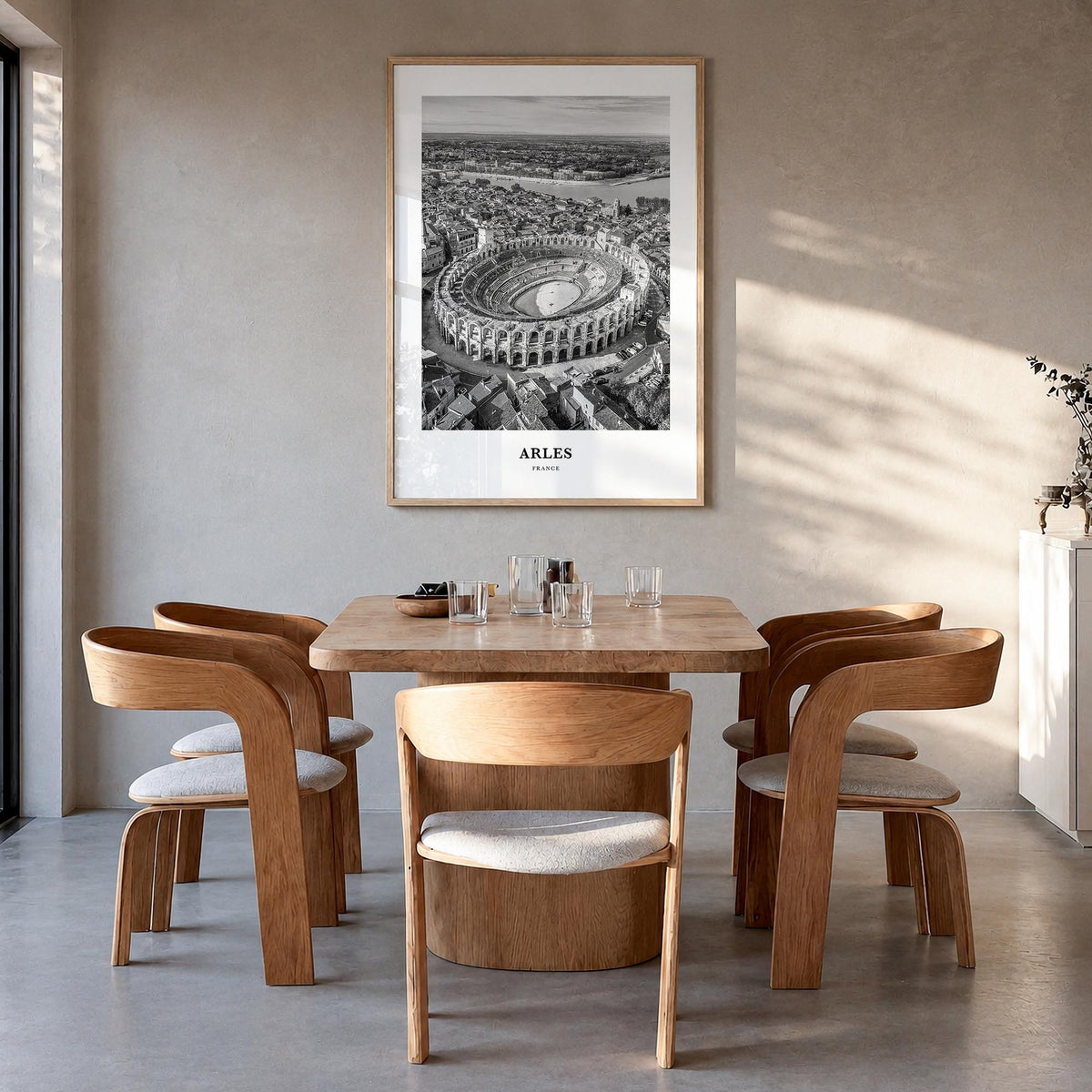 Arles black & white classic poster of France – vertical wall art in natural wood frame, hanging on wall