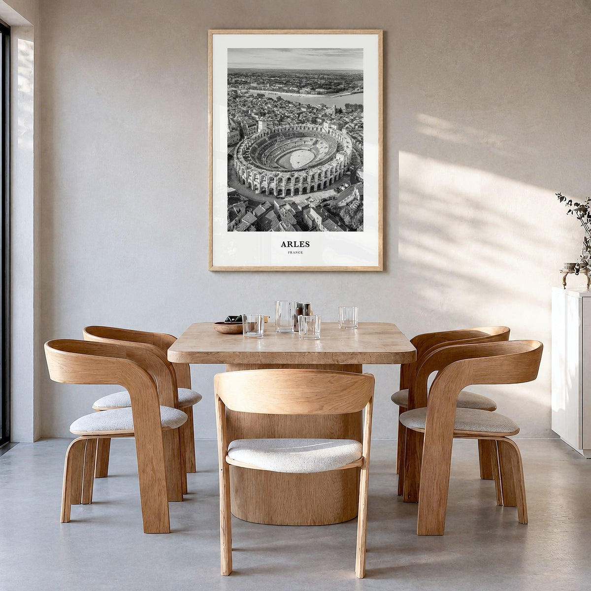 Arles Classic Poster in a natural wood frame, hanging in a dining room