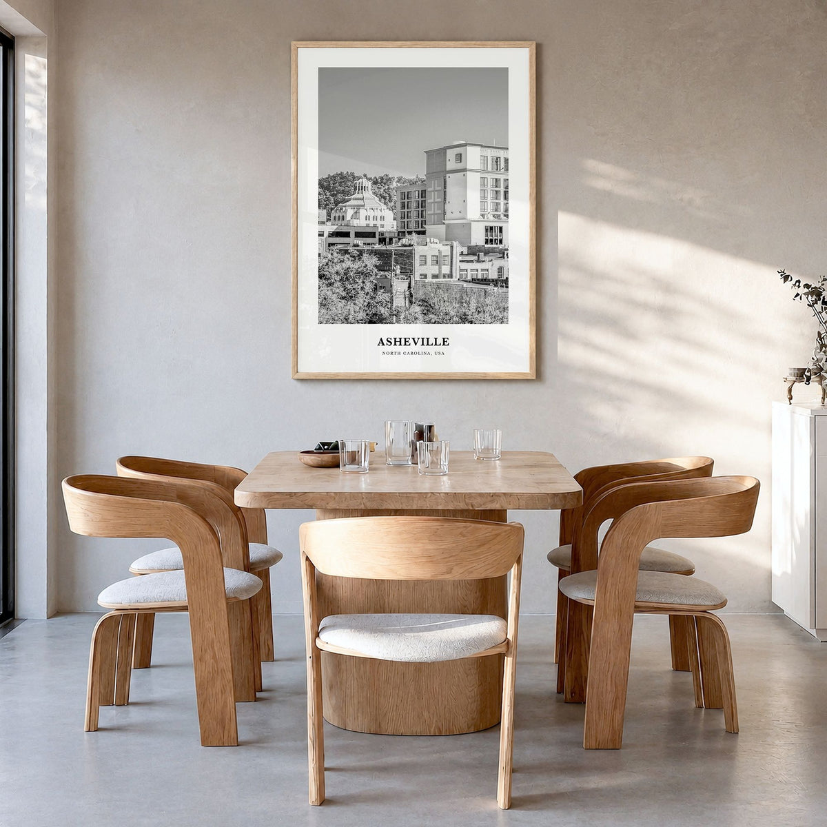 Asheville Classic No 1 Poster in a natural wood frame, hanging in a dining room