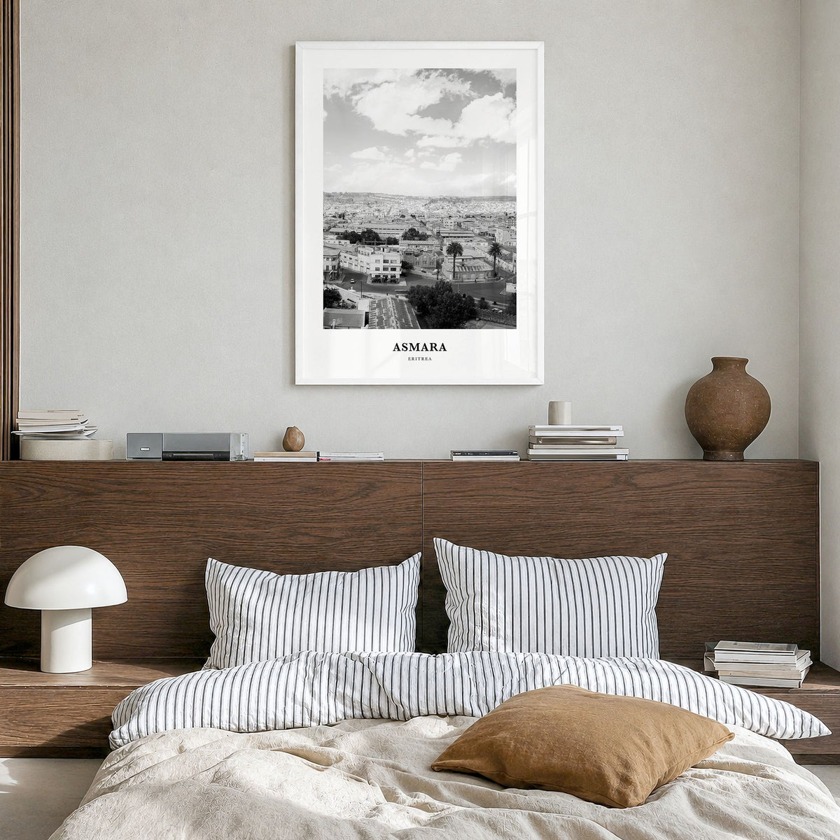 Asmara Classic Poster in a white wood frame, hanging in a bedroom
