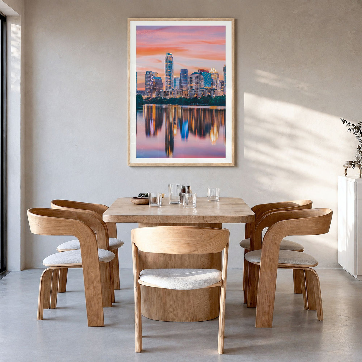 Austin Photo No 2 Poster in a natural wood frame, hanging in a dining room, white border