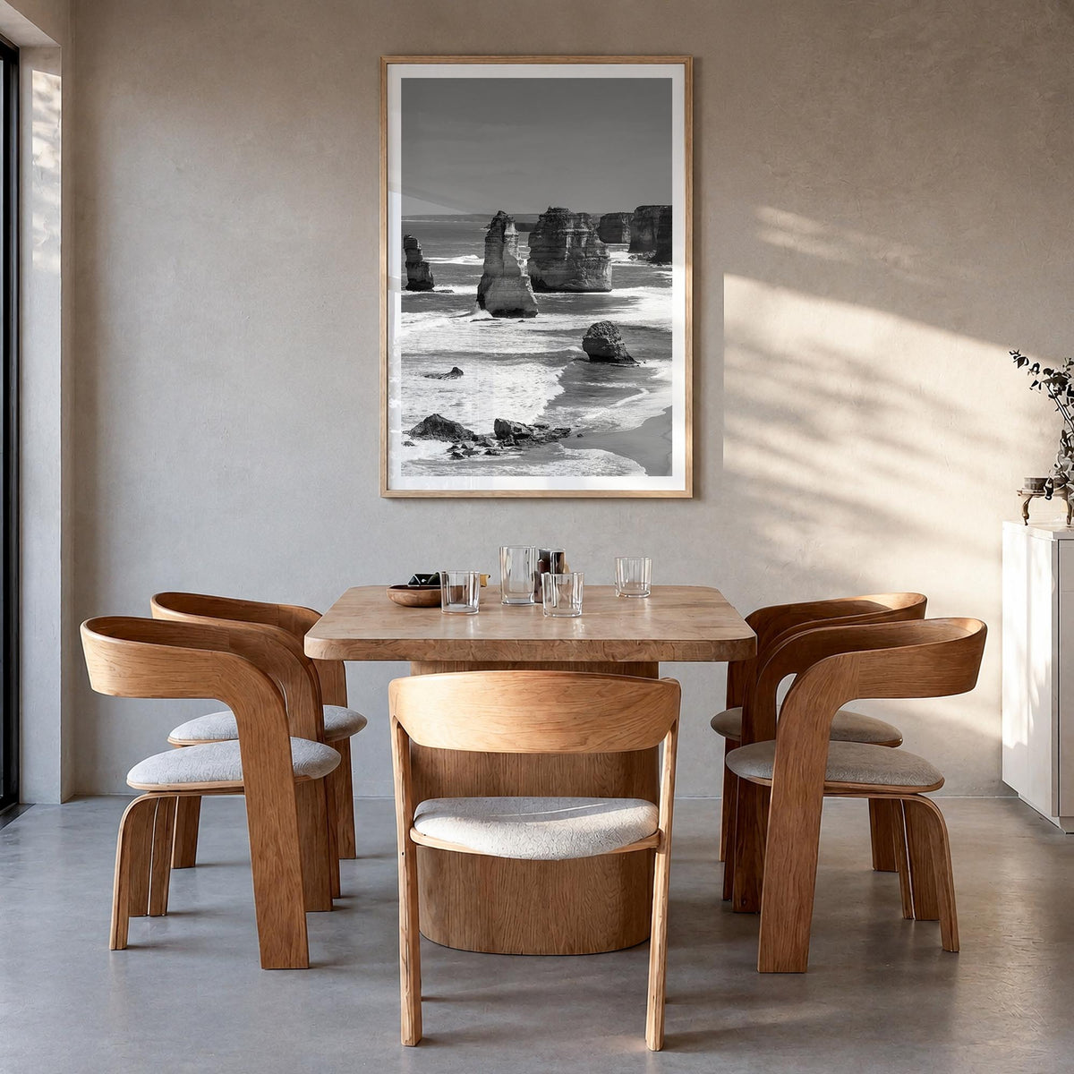 Australia black & white photo poster of Oceania – vertical wall art in natural wood frame with white border, hanging on wall